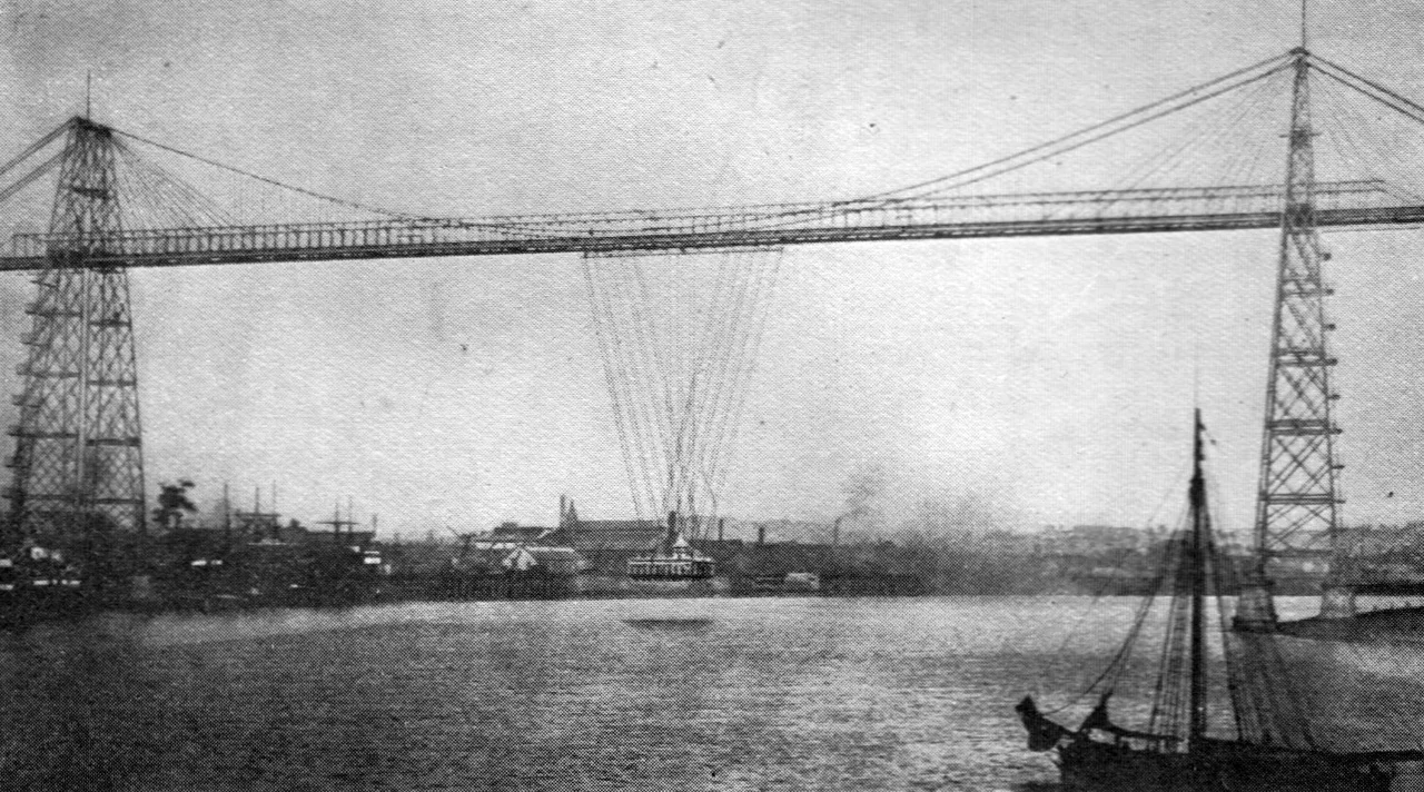 Transporter Bridge, Newport (Monmouth)
Crosses the River Usk and has a clear span between the towers of 592 feet and a height above high water level of 180 feet.
Photo: Valentine &amp; Sons, Ltd.

Newport transporter bridge